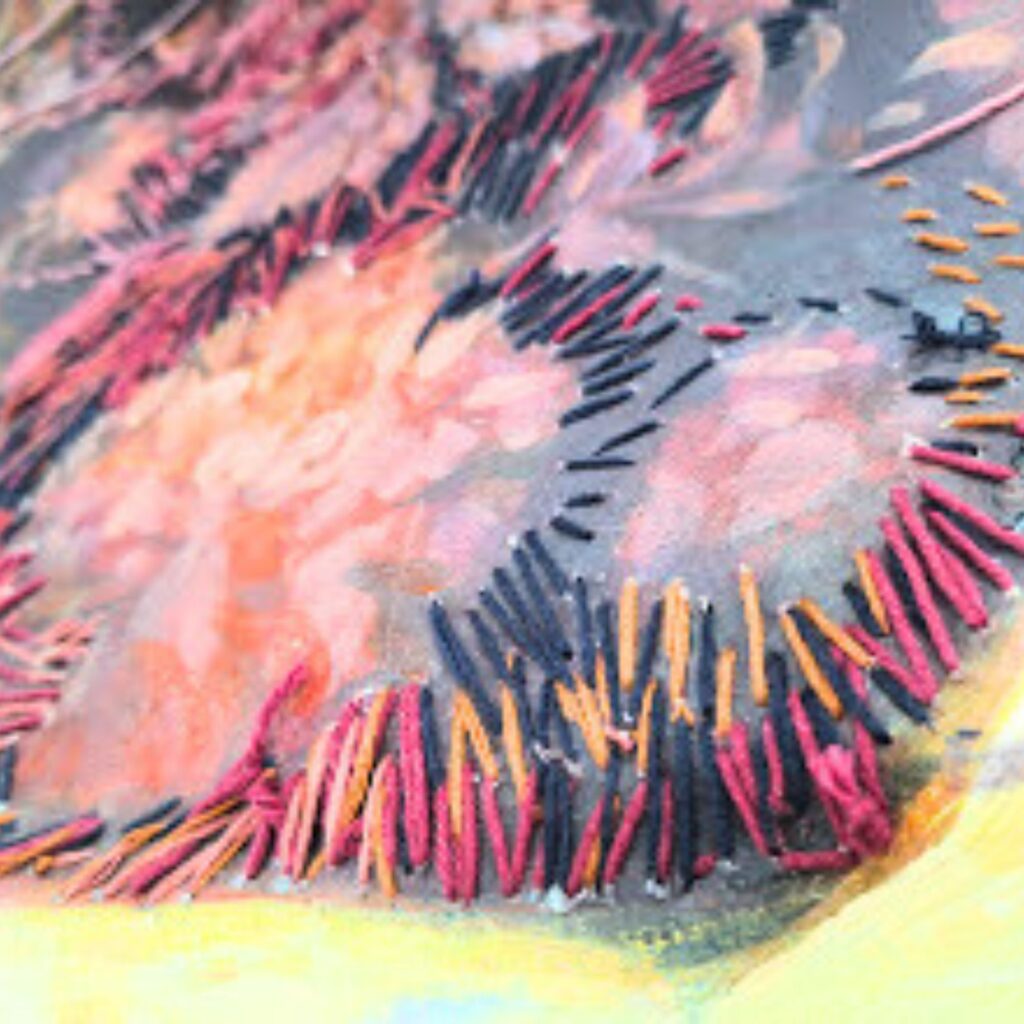 Abstract close-up showing a radial burst of pink, orange, and dark lines emanating from a central area against a pale yellow background.
